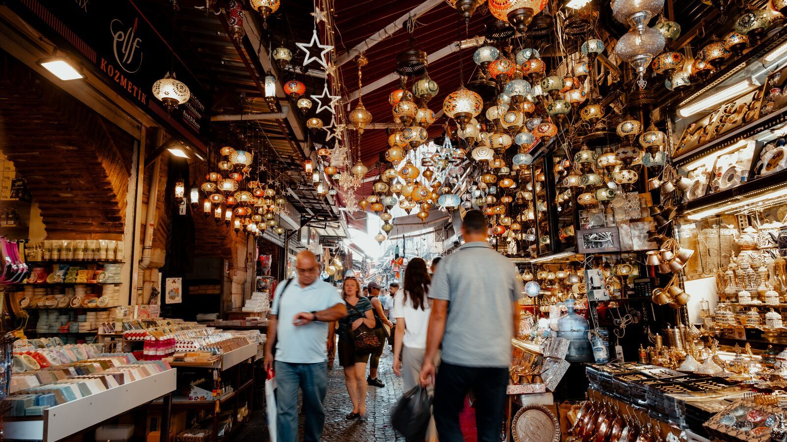 Colourful Turkish lamps and handicrafts glowing inside Istanbul’s Grand Bazaar