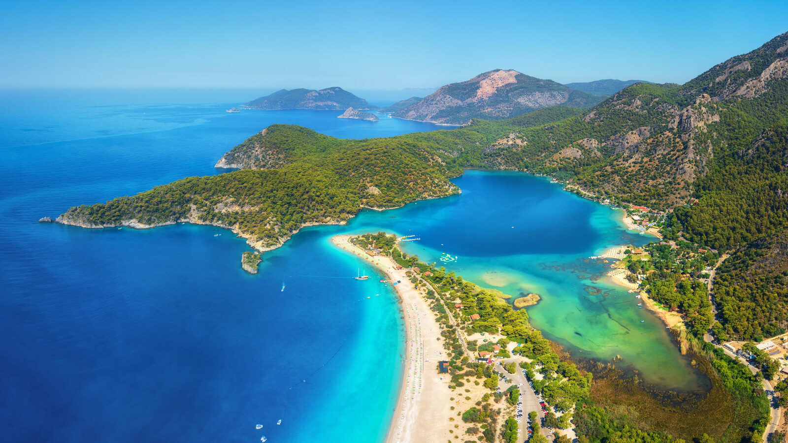 Paragliders drifting above the turquoise Blue Lagoon of Ölüdeniz near Fethiye