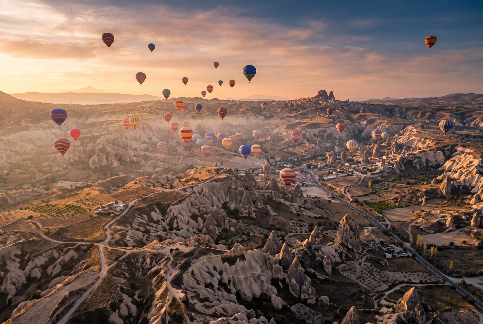 Sunrise Hot-Air Balloon Over the Valleys